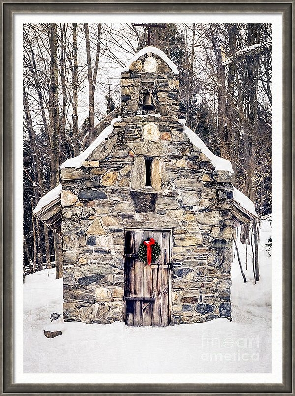 Framed print of an old stone chapel in the snow