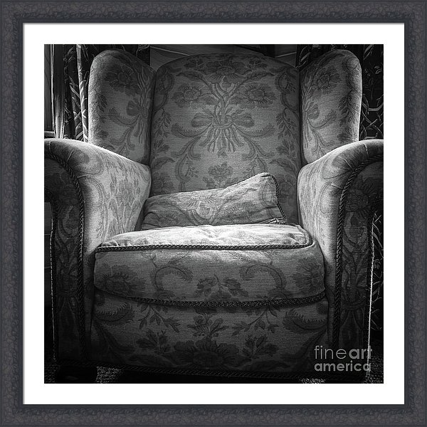 Comfy Chair By The Window Framed Print