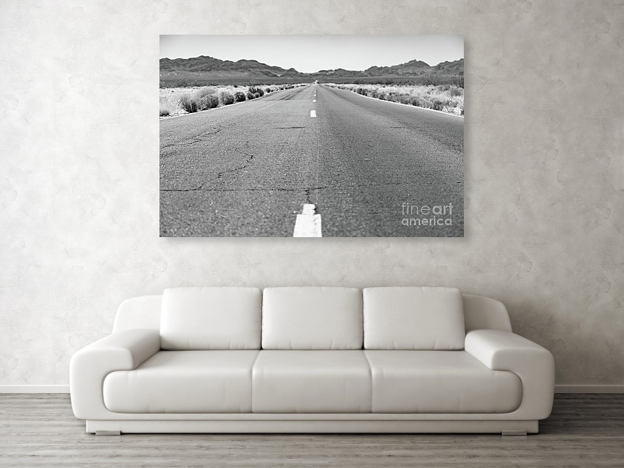 Large scale canvas print of an open stretch of road in the American Southwest.
